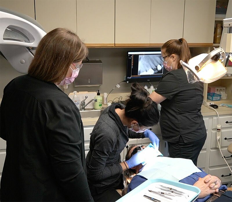 Birmingham dentists performing dental surgery on patient