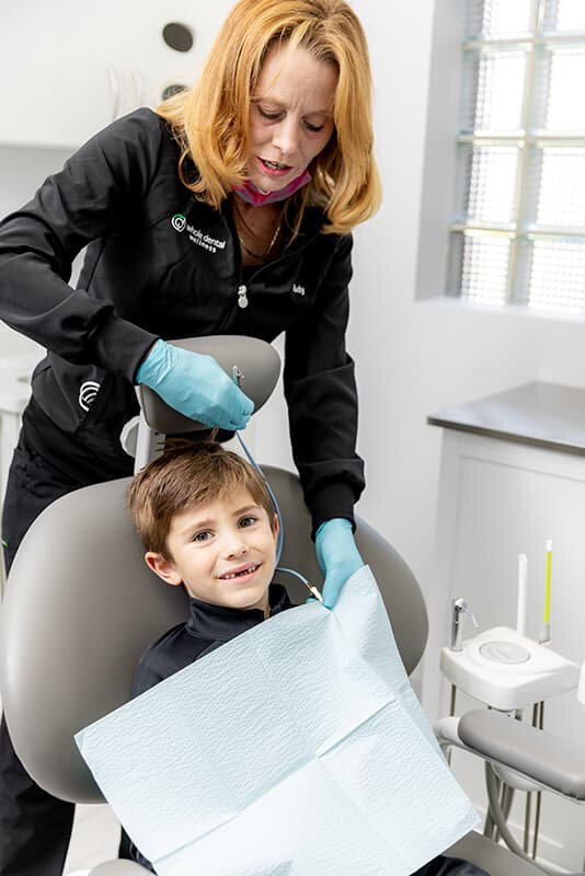 Pediatric dental patient receiving dentist care