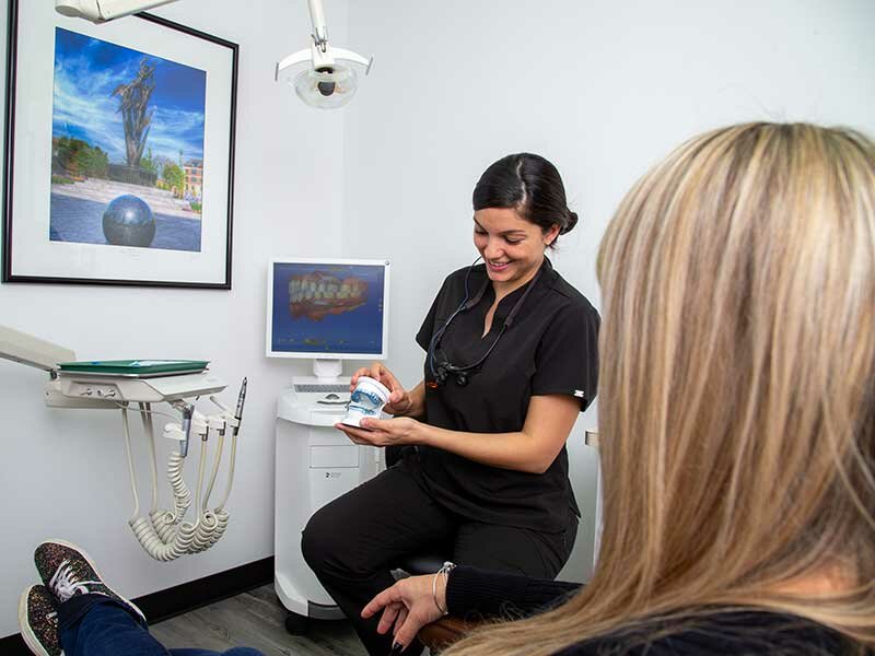 Dental patient seeing Birmingham dentist for dental care instructions